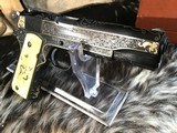Colt Series 70 1911Government Model,
Engraved W/Gold Inlay, Carved Ivory Grips, in Colt Custom Shop Presentation Case - 20 of 25