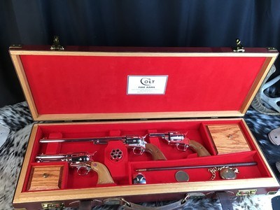 Custom Shop Three Leather Cased Nickel Finished Colt Single Action Army Revolvers with Accessories. Trades Welcome