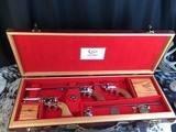 Custom Shop Three Leather Cased Nickel Finished Colt Single Action Army Revolvers with Accessories. Trades Welcome - 1 of 23