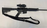 Smith and Wesson M&P 15 .556 caliber rifle with Trijicon ACOG TA31RCO A4 Optic, sling, hard case and eleven magazines