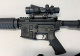 Smith and Wesson M&P 15 .556 caliber rifle with Trijicon ACOG TA31RCO-A4 Optic, sling, hard case and eleven magazines - 4 of 10