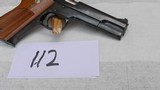 Smith and Wesson Model 52-2. 38SPL. Cal. Semi-Auto.
It has the the Box - 4 of 9