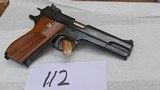 Smith and Wesson Model 52-2. 38SPL. Cal. Semi-Auto.
It has the the Box - 3 of 9